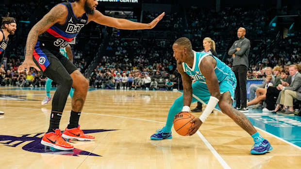 Detroit Pistons forward Marvin Bagley III defends Charlotte Hornets guard Terry Rozier.